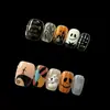 Uñas vestibles de Halloween superventas transfronterizas europeas y americanas, piezas de arte de uñas de calabaza, calavera y fantasma puramente hechas a mano, productos terminados para venta al por mayor de alta gama