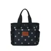 Atacado transfronteiriço nova bolsa de mão impermeável de tecido Oxford com bolinhas, bolsa para marmita, bolsa tote casual de nicho, bolsa para mamãe