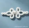 O novo botão em forma de laço de cinco folhas da Mingmei, o botão de morango e o botão de prato são usados para decorar a gola e os punhos de novas roupas femininas de estilo chinês.