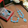 Plata s925 con incrustaciones de calcedonia colgante de superficie de huevo luz lujo moda calcedonia de hielo juego de cuatro piezas aretes anillo pulsera