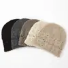 Venta al por mayor transfronteriza 2026 Modelo Nuevo Cachemir Hecho a Mano Crochet Calado Gorro de Punto Gorro de Cachemir Cálido Gorro Protector de Orejas