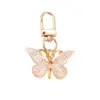 Llavero de Mariposa con Gradiente de Colores Creativo Elegante Popular Colgante de Bolso de Mariposa de Colores Colgante Sencillo para Bolsa de Auriculares