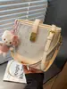 Bolsa de Cubo Linda de Niña Coreana Portátil 2026 Nueva Moda de Nicho de Primavera Bolso de Hombro Bolso Cruzado