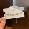 Pulsera de hilo con trébol de cuatro hojas y perla para mujer, delicada y etérea, ajustable, versátil, joyería elegante y de moda para niñas