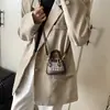 Bolsa Infantil 2026 Nuevo Color Coreano Bloque de Color Mini Ultra Pequeña Forma de Concha Elegante Bolsa para Auriculares Lápiz Labial Padre-Hijo Bolso Cruzado