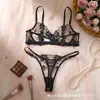 Conjunto de lencería europeo y americano de estilo transfronterizo con encaje negro bordado, que incluye un tanga sexy transparente y un conjunto de dos piezas, disponible para venta al por mayor