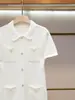 Shenzhen Nanyou Ropa Fina de Mujer Verano Nueva Llegada Estilo Suave de Dama Cuello Solapa Manga Corta de Punto de un Solo Botón Mujer