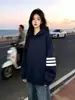 Sudadera con capucha a rayas de manga larga de diseño de nicho moderno estilo coreano para mujer, nuevo top versátil casual de otoño e invierno