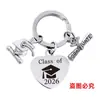 Pingente de Chaveiro Aço Inoxidável Coração Cruz Europeia e Americana Chapéu de Formatura Transfronteiriço Presente Temporada de Formatura 2026 Chaveiro de Metal Gravado