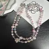 Elegante corrente de celular transversal com borboleta adornada de cristal, com contas feitas à mão e alça de pescoço para capa de celular