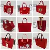 Bolsas de fieltro para Año Nuevo 2026, bolsas de regalo promocionales para bancos y empresas, bolsas de regalo navideñas, bolsas de mano, impresión de logo personalizado