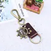 Llavero de Cuerda de Cuero para Coche para Hombres y Mujeres, Colgante Creativo de Cuero de Aleación de Timón para Parejas, Llavero de Cuero de Vaca de Suministro Transfronterizo