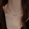 Collar de perlas de doble capa estilo retro francés para mujer, ligero, lujoso, de alta gama, con cadena para el cuello.