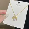 Collar Elegante de Perlas con Lazo Dulce, Femenino, Moderno y Lindo, Súper Hada, Cadena para Clavícula de Gama Alta y Versátil