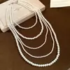 Collar largo vintage floral de perlas con incrustaciones de diamantes, cadena de suéter elegante estilo francés, lujo ligero y de alta gama, accesorio versátil