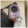 Bolso plisado de diseño único y nicho para mujer, nuevo bolso cruzado de moda 2026, bolso de mano pequeño súper popular, bolso de cuerno
