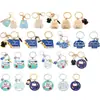 Llaveros personalizados más vendidos transfronterizos, dijes para mochilas, colgantes de aleación para la temporada de graduación, accesorios con temática de campus para las mochilas de los estudiantes