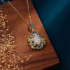Estilo chinês estilo antigo queimado azul estilo palácio Hetian jade pingente esmalte pintado laço estilo retro temperamento clavícula