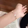Producto Popular de Xiaohongshu: Pulsera Exquisitamente Elaborada de Flor de Trébol de Cuatro Hojas para Mujer, Ajustable, con Diamantes Brillantes, Lujo Ligero, Delicada y de Moda, Disponible para Dropshipping