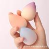 Huevo de belleza de concha de garra de gato color degradado huevo de belleza al por mayor borla de maquillaje al por mayor comercio exterior huevo de belleza rt entrega de una pieza