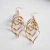 Brincos de borla em espiral em forma de diamante transfronteiriços europeus e americanos, brincos de luxo leve de alta qualidade, brincos exagerados da moda e estilosos para mulheres