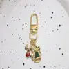 Llavero Colgante de Metal de Dibujos Animados Lindos de Papá Noel Europeo y Americano Alce Sombrero de Navidad Regalo de Navidad