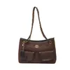 Bolso retro de ante a la moda 2026 nuevo bolso cruzado versátil para mujer con un toque de alta gama para ir al trabajo, bolso de hombro único bajo el brazo