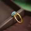 Plata de ley S925 chapada en oro incrustada jade azul natural calidad A garra de cuatro puntas simple unos pocos fideos de huevo pequeños estilo antiguo exquisito