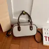 Nova bolsa Boston com pingente de contas retrô 2026, uma bolsa de mão de nicho, bolsa almofada, bolsa transversal colorida fashion para mulheres