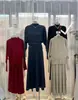 Conjunto de Tricô Retrô Francês para Mulheres 2026 Primavera Novo Estilo Suéter de Manga Longa Gola Alta Meia e Saia Elegante Conjunto de Duas Peças