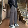 Calça de trabalho de algodão da moda estilo americano com múltiplos bolsos para homens, nova para primavera/outono, casual, corte solto, versátil, cor sólida, perna reta