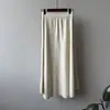 Saia midi de malha minimalista estilo coreano para mulheres, nova coleção outono/inverno 2026, cintura alta, modelagem que afina, caimento solto, saia de corte A macia e confortável com barra flare