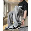 Pantalones deportivos ligeros de verano para hombre, corte holgado, secado rápido, pantalones largos casuales de hombre con diseño de patchwork curvo de moda.