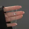 Colar de prata de lei S925 com textura de estrela e lua para mulheres com longos pingentes, design único, estilo coreano, corrente simples e versátil para a clavícula