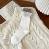 Calcetines de mujer de moda estilo coreano, con bloques de color, puños de doble canalé y bordes enrollados, longitud hasta la mitad de la pantorrilla, con etiquetas de tela con letras estilo Miu, calcetines apilables a la moda