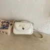 Bolso cuadrado pequeño casual de nicho, simple y elegante, nuevo modelo primavera 2026, alto valor estético, color sólido, bandolera y bolso de hombro de moda