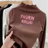 Camiseta Térmica Escovada de Manga Longa com Babados e Gola Meio Alta, Novo Estilo Outono/Inverno 2026 para Bebês Meninas