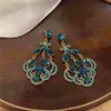 Pendientes europeos y americanos de gota con incrustaciones de diamantes transfronterizos, pendientes de moda de nicho de alta gama, lujo ligero, pendientes únicos y elegantes para mujer
