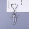 Nuevo llavero creativo de aleación de zinc, dulce y genial, con diseño de mariposa hueca, colgante para bolso, accesorio plateado, piezas de decoración DIY