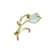 Broche Tulipa Vintage Estilo Francês com Strass Luxuosos e Design de Flor Olho de Gato, um Acessório Exquisito de Nicho para Casacos Femininos