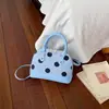 Otoño temprano 2026 nuevo elegante y simple estilo coreano para mujer bolso cruzado de lunares bolso tipo concha al por mayor bolsos de mujer