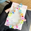 Cadena de teléfono de cuentas esmeriladas de colores transfronteriza, un accesorio de nicho y de alta gama para bolsos, una cadena elegante para bolsos de mano y un dije de cuentas para evitar perder tu teléfono