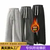 Calça de moletom masculina TK transfronteiriça europeia e americana com forro de fleece, cordão, perna reta larga, modelagem solta, calça esportiva longa com bolsos