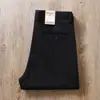 Otoño e invierno 2023 Nuevos pantalones casuales rectos holgados de algodón peinado lavado elástico de color liso de alta gama gruesos para hombre