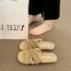 Pantuflas peludas de suela plana súper populares para mujer, nuevas pantuflas de algodón peludas de moda de una tira para otoño e invierno 2026