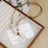 Artículos de cerámica de Jingdezhen nuevos, culturales y creativos, de gran venta, collares de cerámica de Jingdezhen, accesorios florales de moda al por mayor, productos artísticos de alta gama de estilo chino