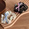 Pinza para el pelo de cachorro coreana linda de lunares con lazo Pinza de tiburón para pelo semirecogido Accesorios para el pelo versátiles de alta gama Accesorios para la cabeza