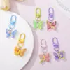 Llavero de mariposa de colores pastel, exquisito colgante para mochila de estudiante, llavero de coche, accesorio de nicho de alta apariencia al por mayor