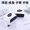 Caja de regalo de cuero PU de alta gama para joyería, embalaje en forma de corazón, caja de luz LED, embalaje de anillo de papel colgante, una generación de cabello