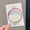 Pulseira de corda colorida zongzi do Festival do Barco-Dragão 2026 novo modelo pulseira trançada artesanal étnica infantil atacado corda vermelha
